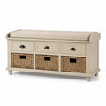 Panca in legno con cuscino e cestini intrecciati beige